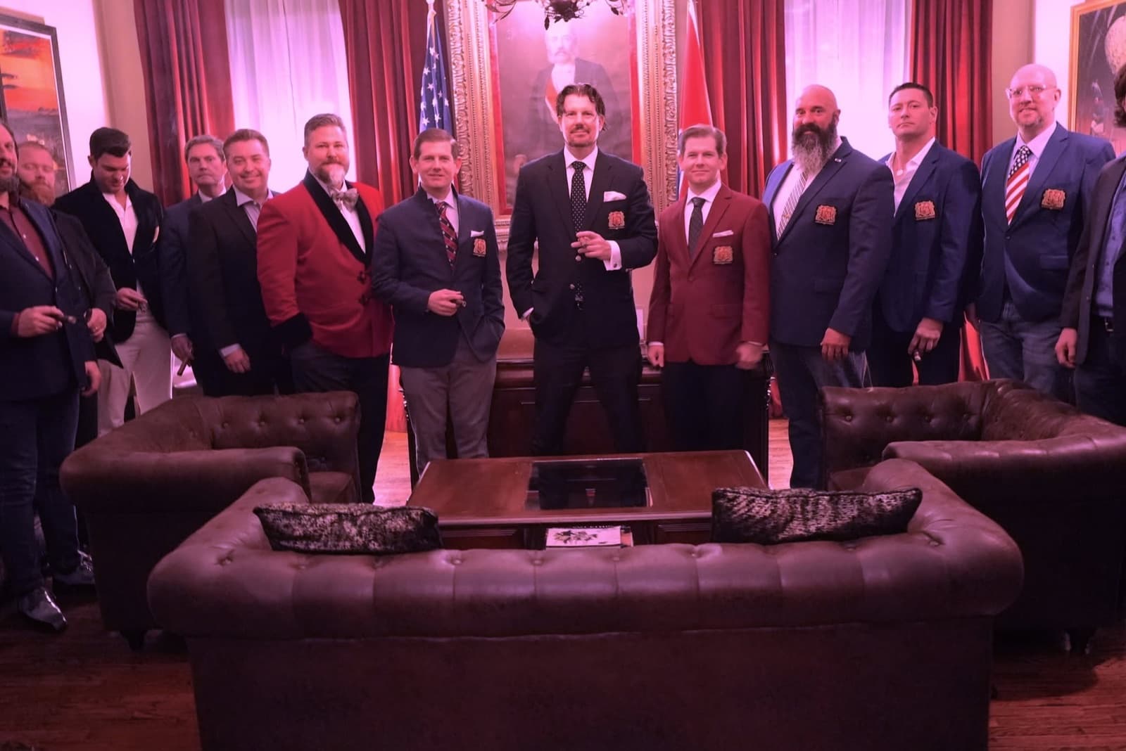 Members wearing RMH blazer patches at a formal gathering.